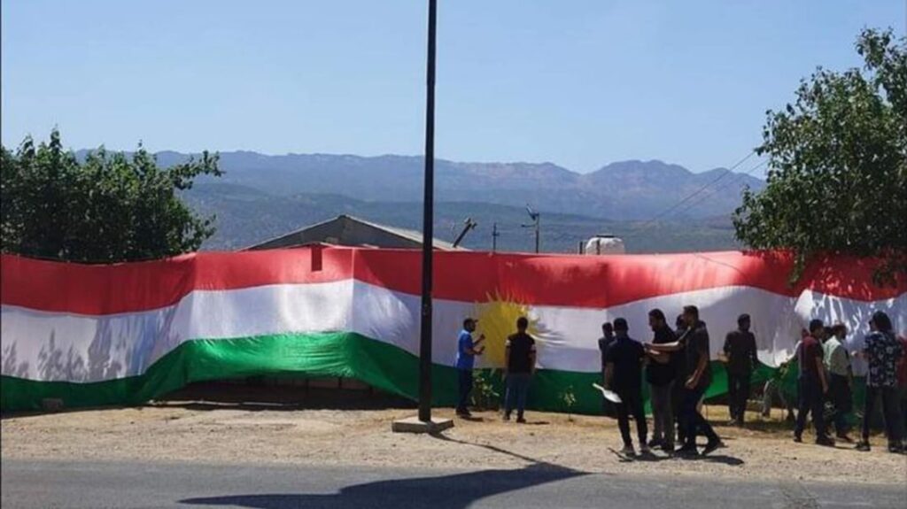 Villagers in Amedi's Guharze raise Kurdistan flag in protest against Turkish military operations