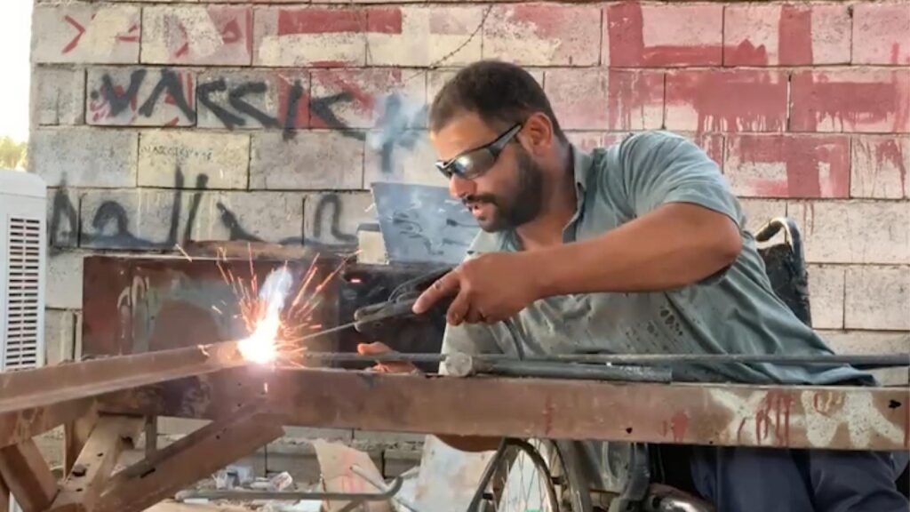 Paralyzed Iraqi blacksmith defies odds, inspires with his craft