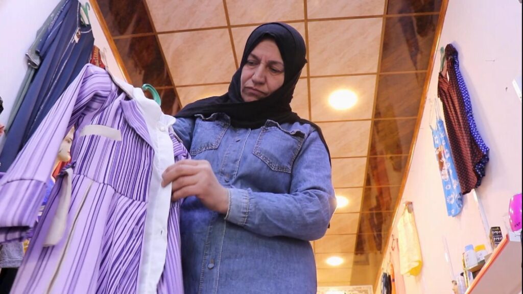 Resilient Mosul woman rebuilds life with women’s clothing store in Zanjili