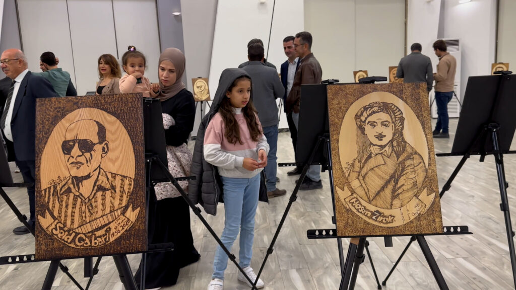 Syrian artist Mahdi Hussein hosts wood burning art exhibition in Erbil