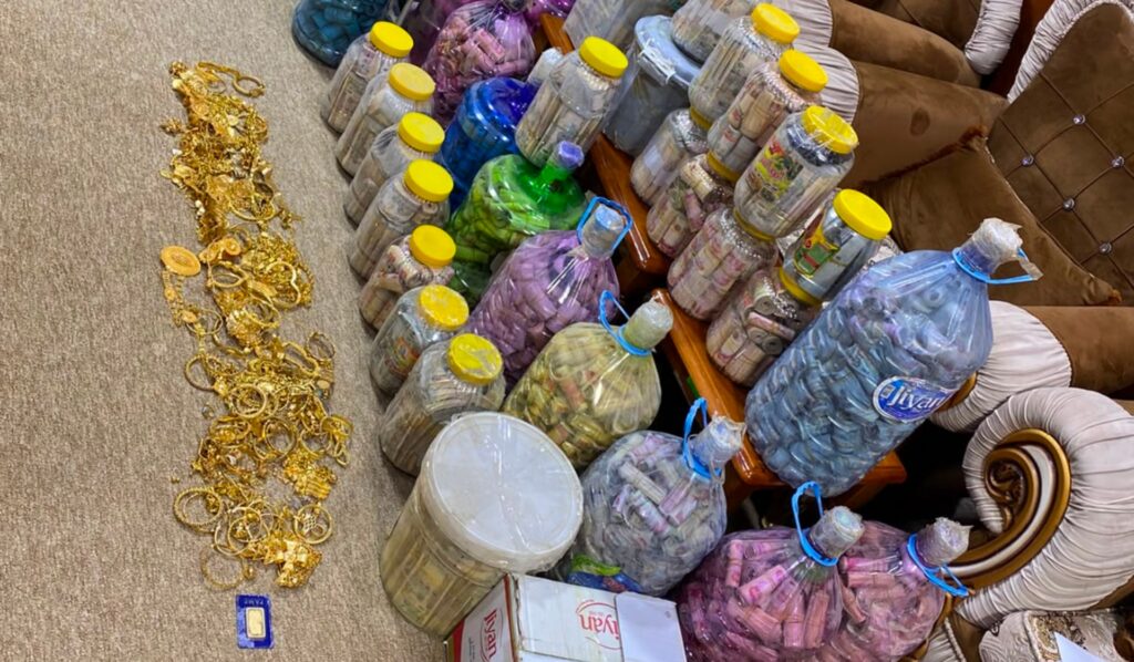 Investigators find another $19 million hidden in walls and water jugs